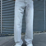 Light gray baggy jeans with straight wide legs and front button fly
