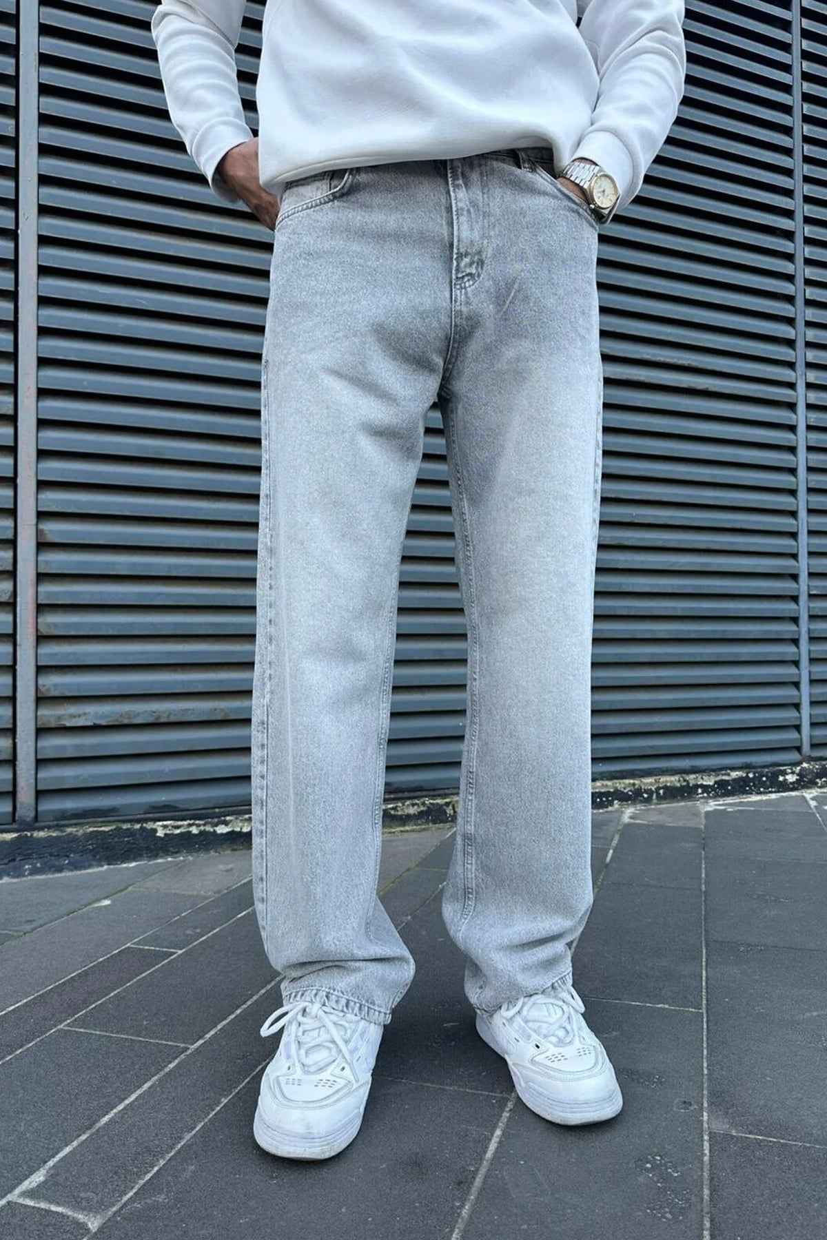 Light gray baggy jeans with straight wide legs and front button fly