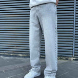Light gray baggy jeans with relaxed straight legs, belt loops and stitched seams