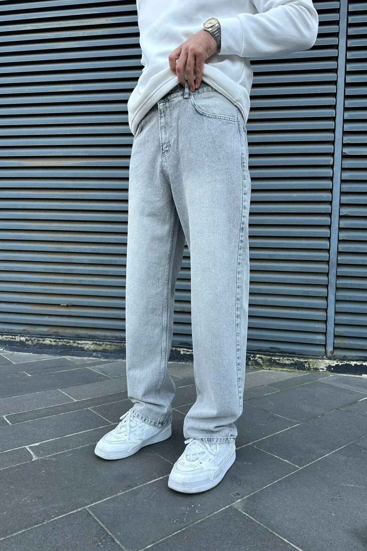 Light gray baggy jeans with roomy wide leg, front pockets and belt loops