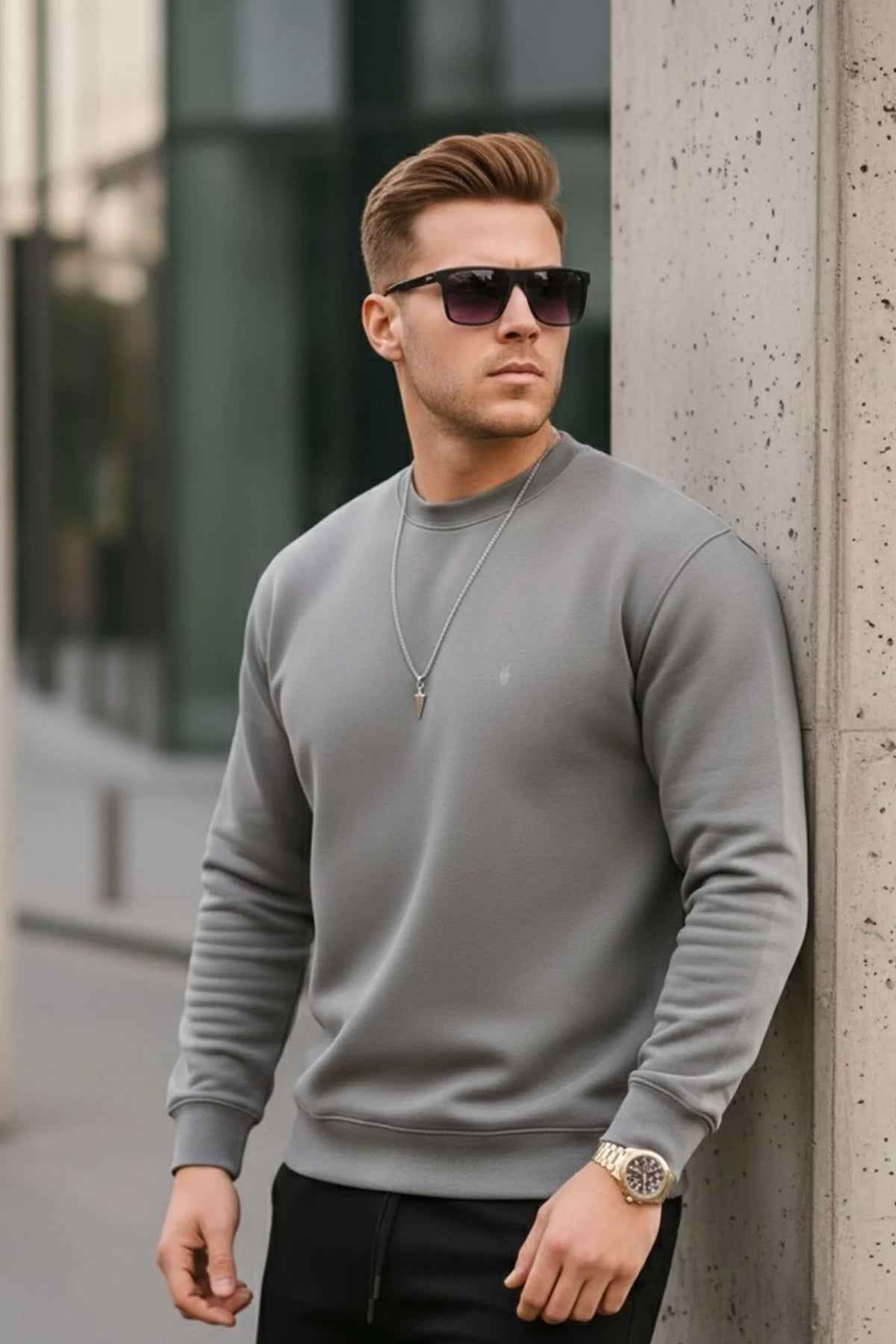 Men's gray crewneck sweatshirt with ribbed cuffs and small chest logo