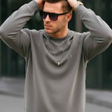 Men's gray crewneck sweatshirt with long sleeves and small chest logo