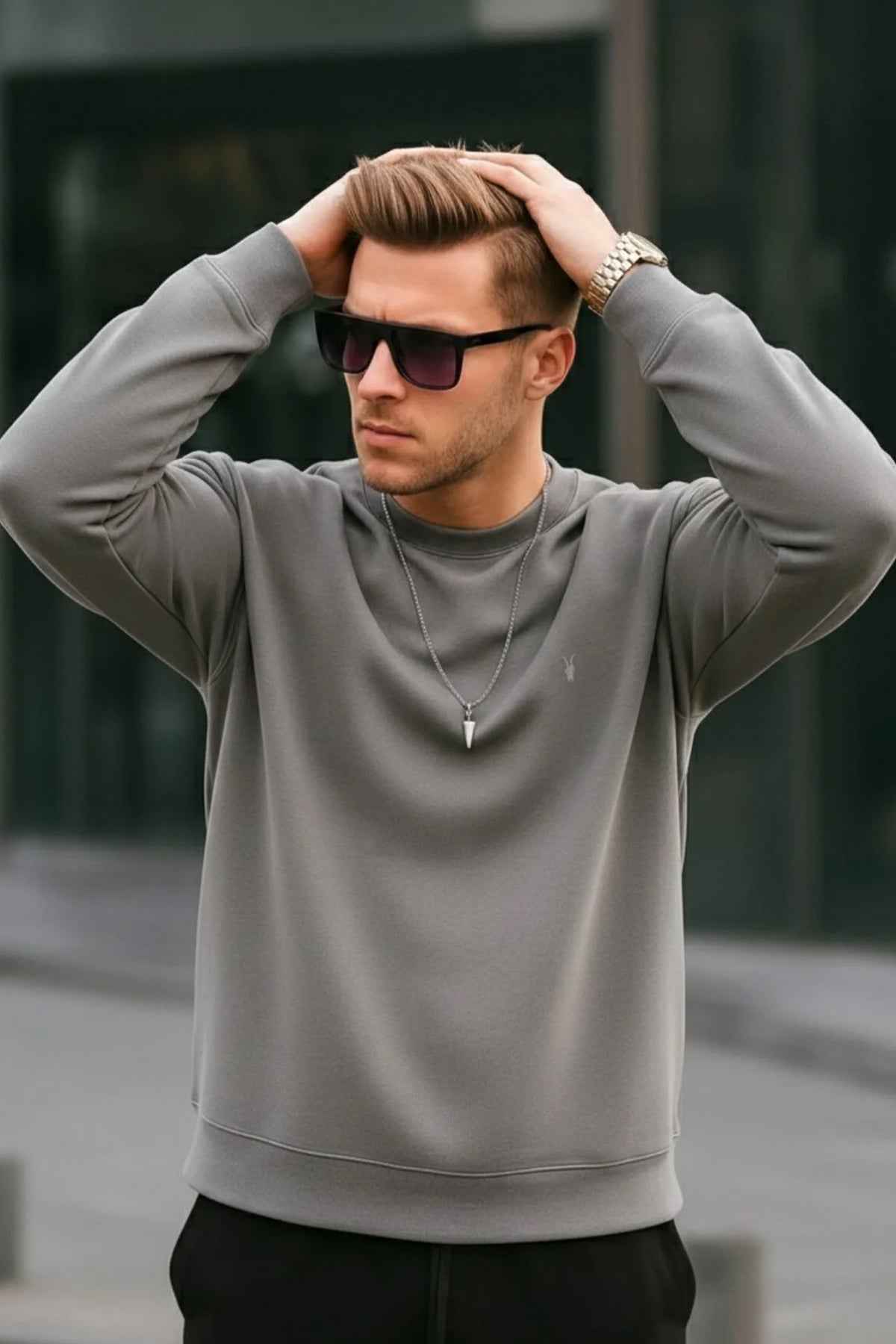 Men's gray crewneck sweatshirt with long sleeves and small chest logo