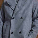 Gray double-breasted coat front with notch lapels and black button fastening