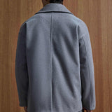 Gray oversized double-breasted coat back view with center seam and full sleeves