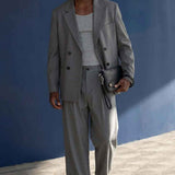 Gray oversized double-breasted suit jacket and wide-leg trousers set by AKA