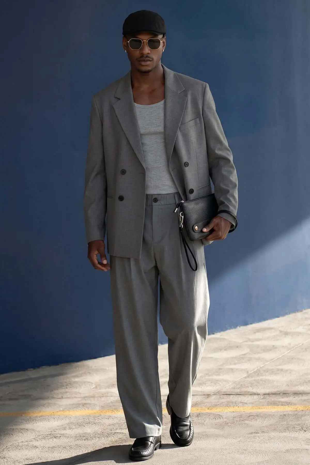 Gray oversized double-breasted suit jacket and wide-leg trousers set by AKA