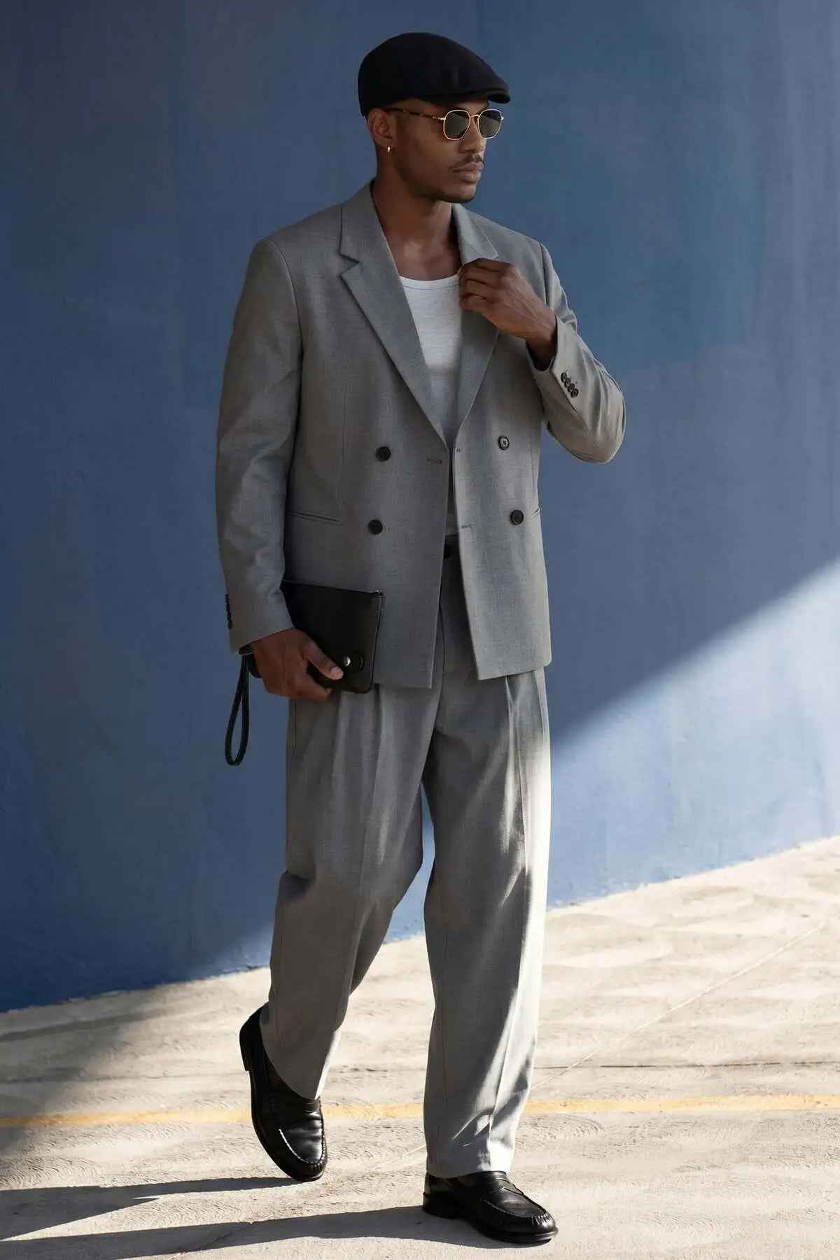 Gray oversized double-breasted suit jacket with matching wide-leg trousers