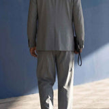 Gray oversized suit jacket and trousers set, back view