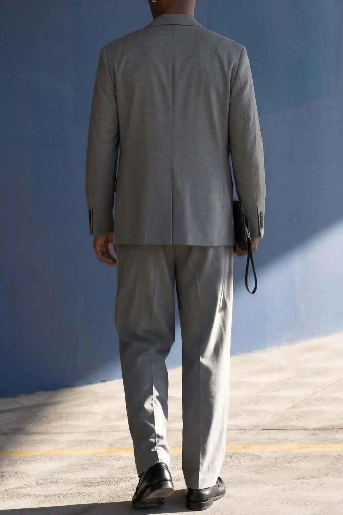 Gray oversized suit jacket and trousers set, back view
