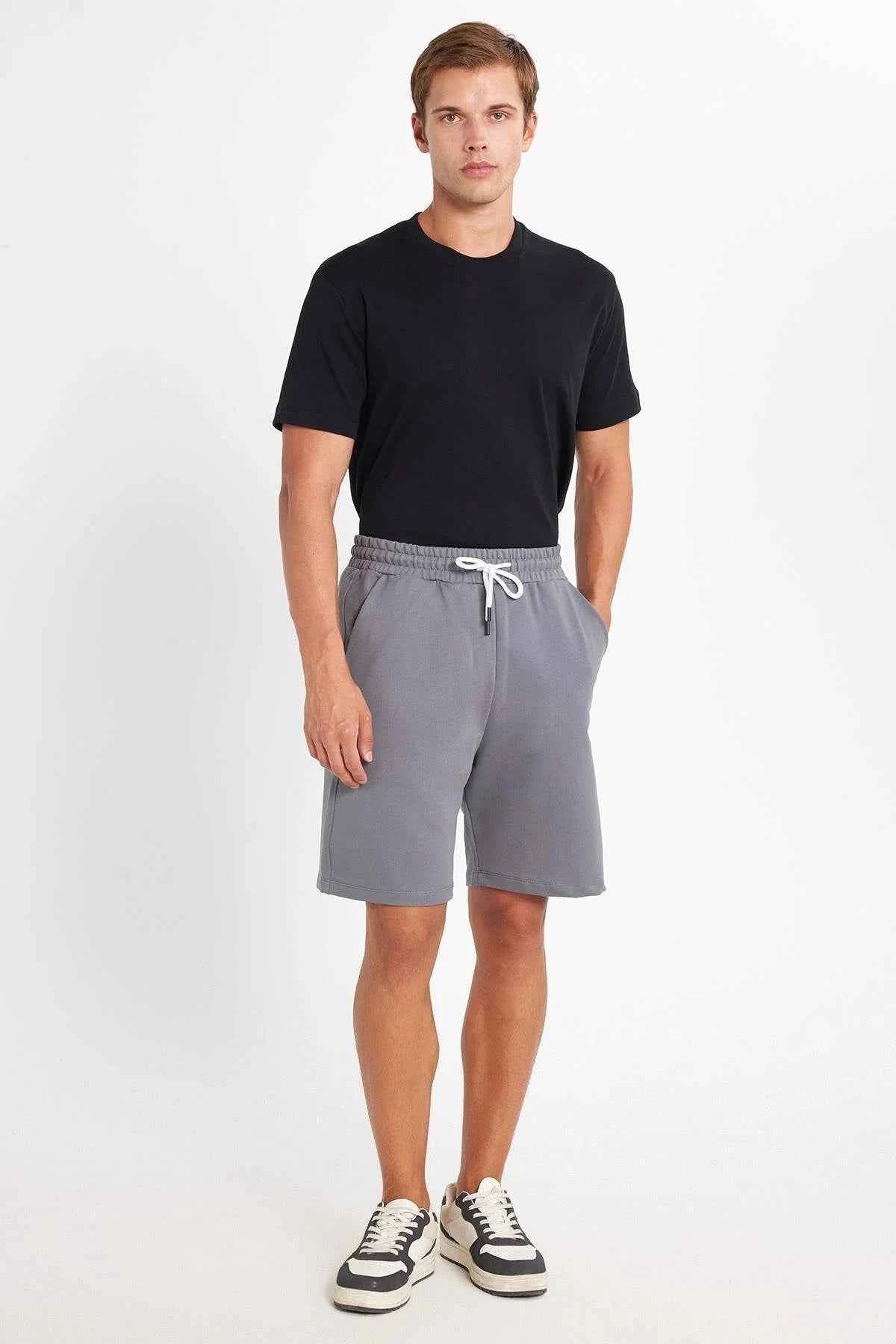 Men's gray drawstring shorts with elastic waistband, knee-length