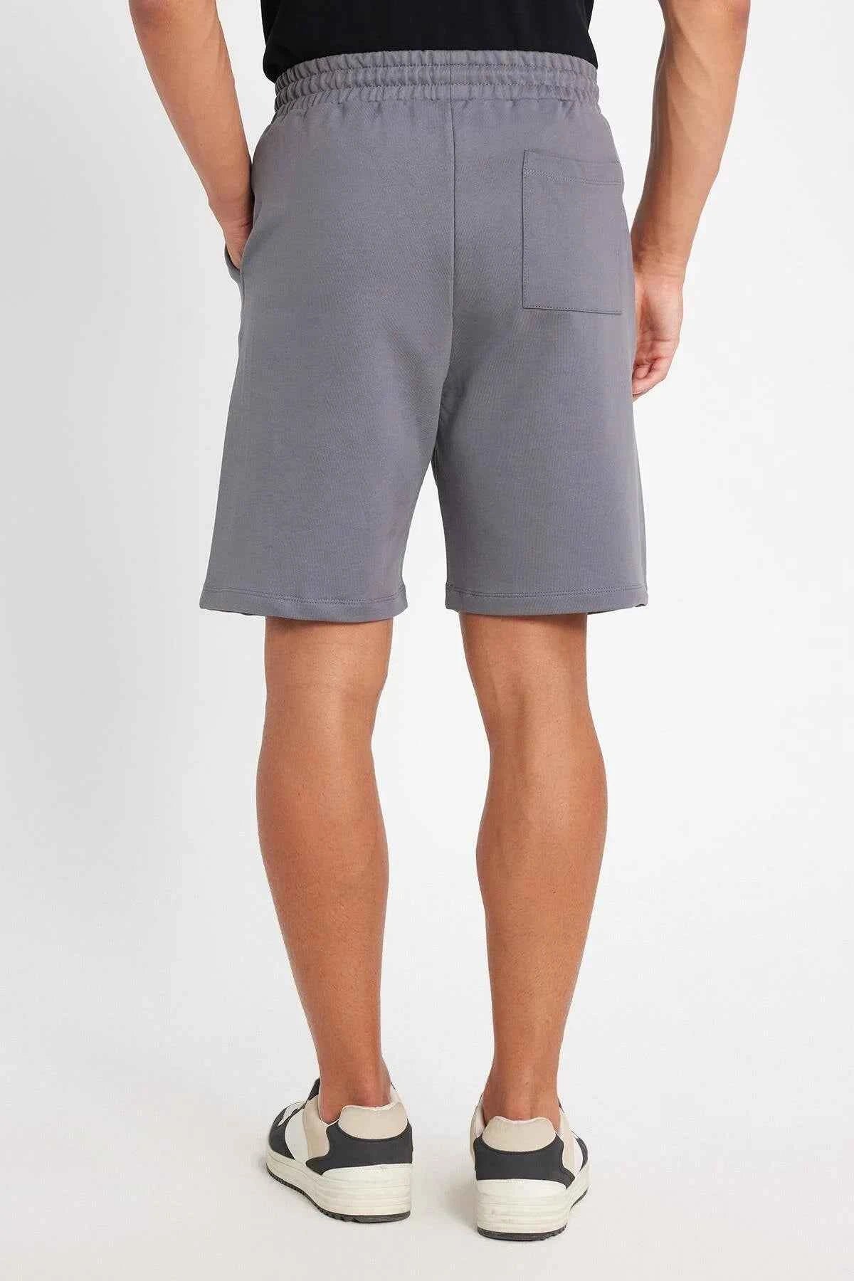 Men's gray shorts back view with elastic waistband and side seams