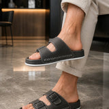 Men's dark gray slide slippers with two adjustable straps and white-stitched edge