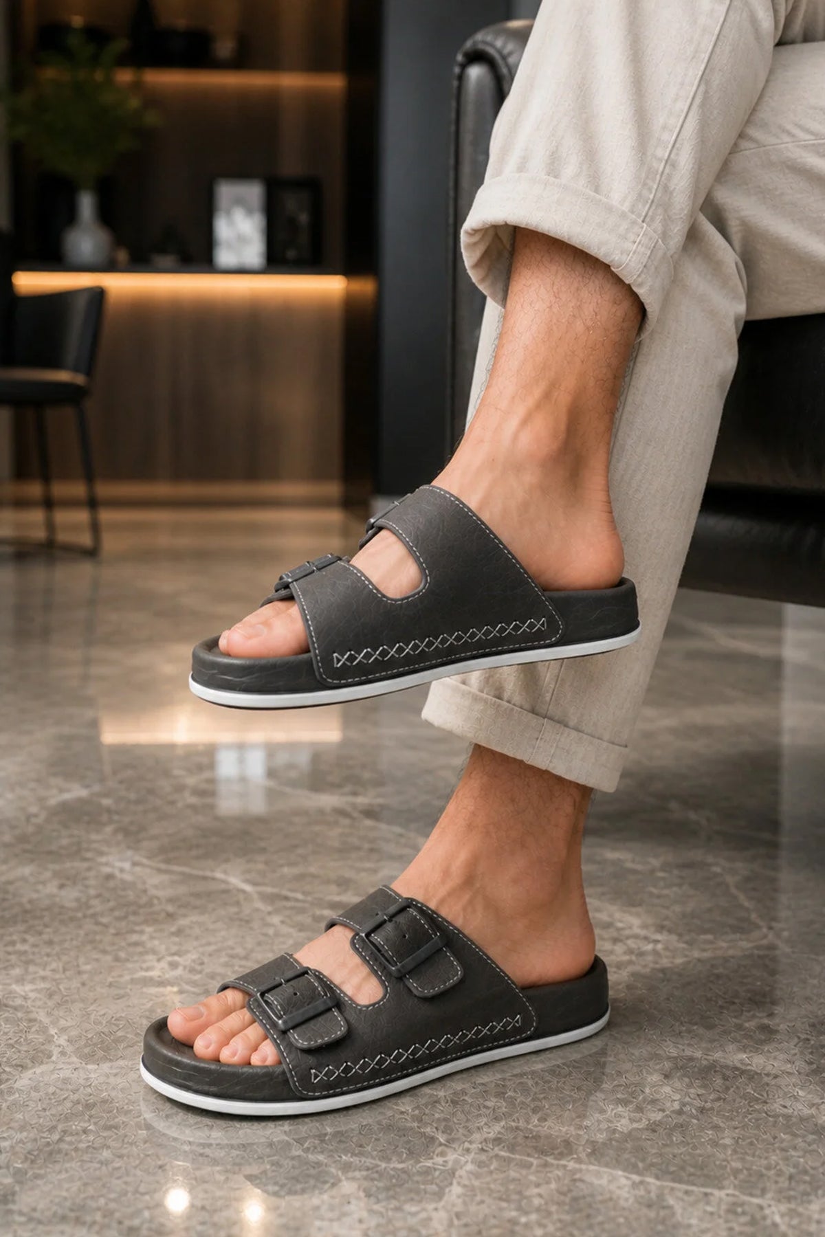 Men's dark gray slide slippers with two adjustable straps and white-stitched edge