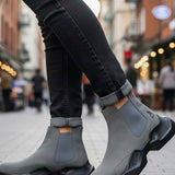 Gray suede ankle boots with elastic side panels and rugged rubber sole