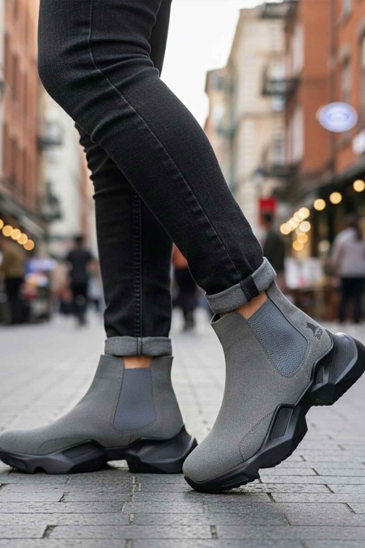 Gray suede ankle boots with elastic side panels and rugged rubber sole
