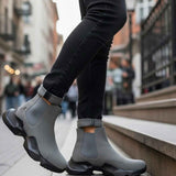 Gray suede ankle boots angled view, cushioned pull tab and chunky outsole