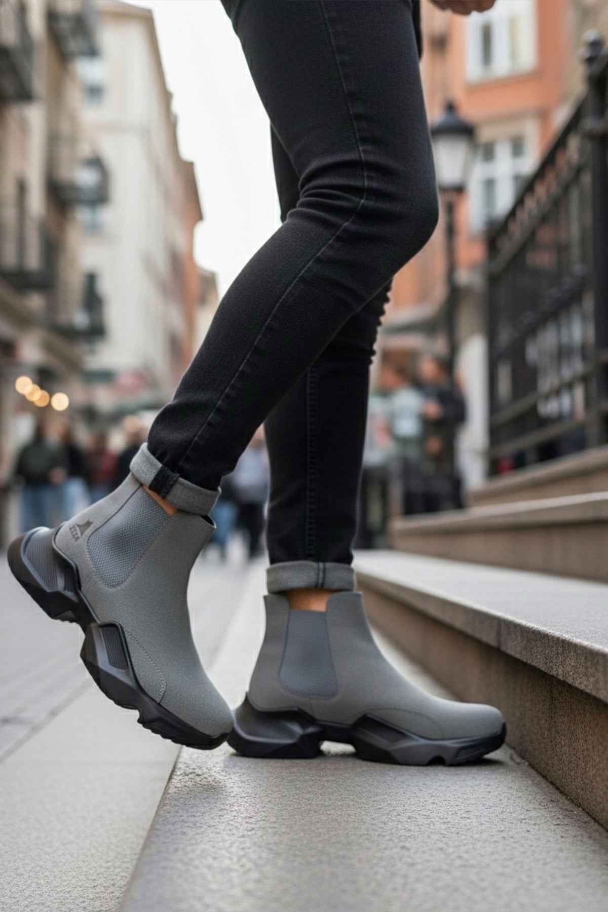 Gray suede ankle boots angled view, cushioned pull tab and chunky outsole