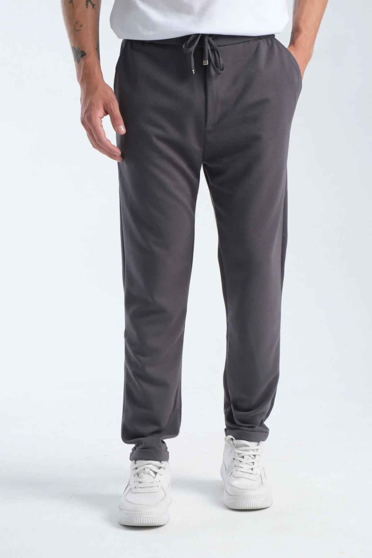 Men's gray sweatpants, front view, elastic cuffs and drawstring