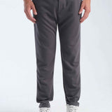 Men's gray sweatpants, front view, straight tapered legs with drawstring