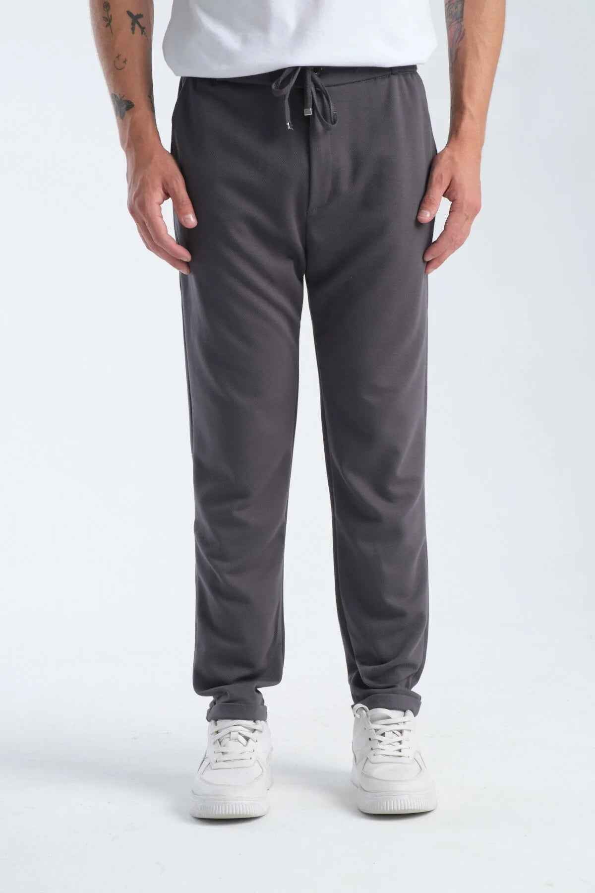 Men's gray sweatpants, front view, straight tapered legs with drawstring