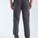 Men's gray sweatpants, rear view, tapered fit with cuffed ankles