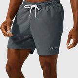 Men's gray swim shorts front view, white drawstring and side logo