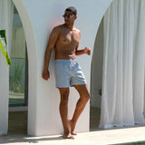 Mayom men's gray swimming shorts, standing side view
