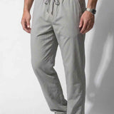 Men's gray track pants, front view, elastic waist with drawstring