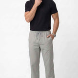 Men's gray track pants with tapered legs and elastic drawstring waist