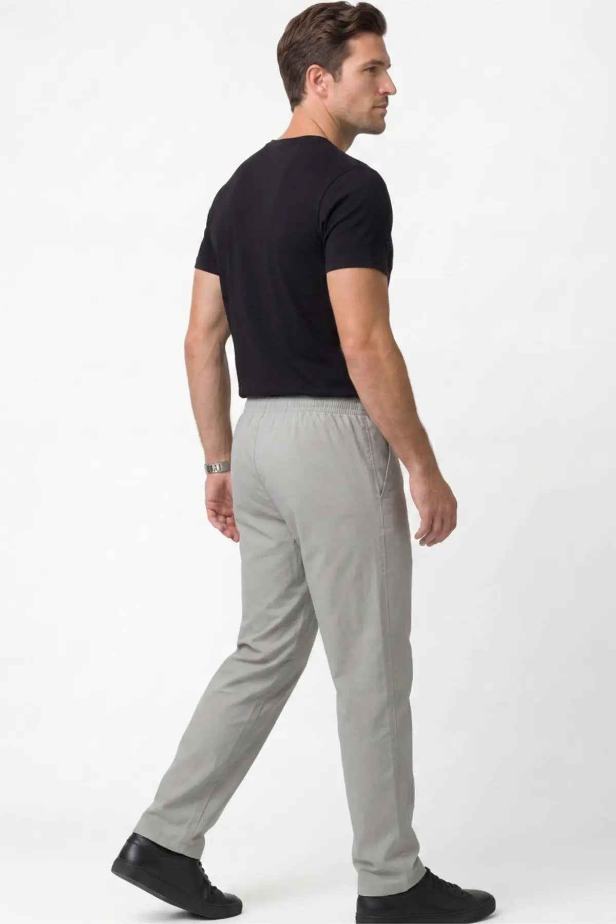 Men's gray track pants, side view, elastic drawstring waist and tapered hem