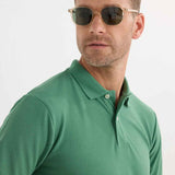 Men's Serin green polo shirt close-up of collar and top button placket