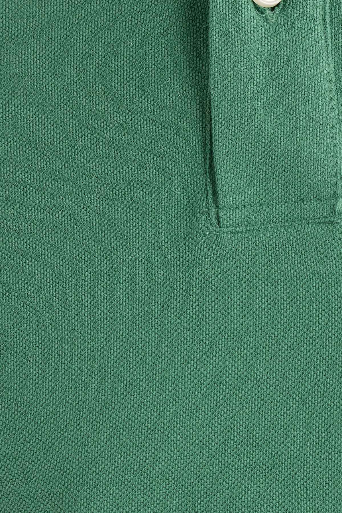 Men's Serin green polo shirt fabric knit texture close-up