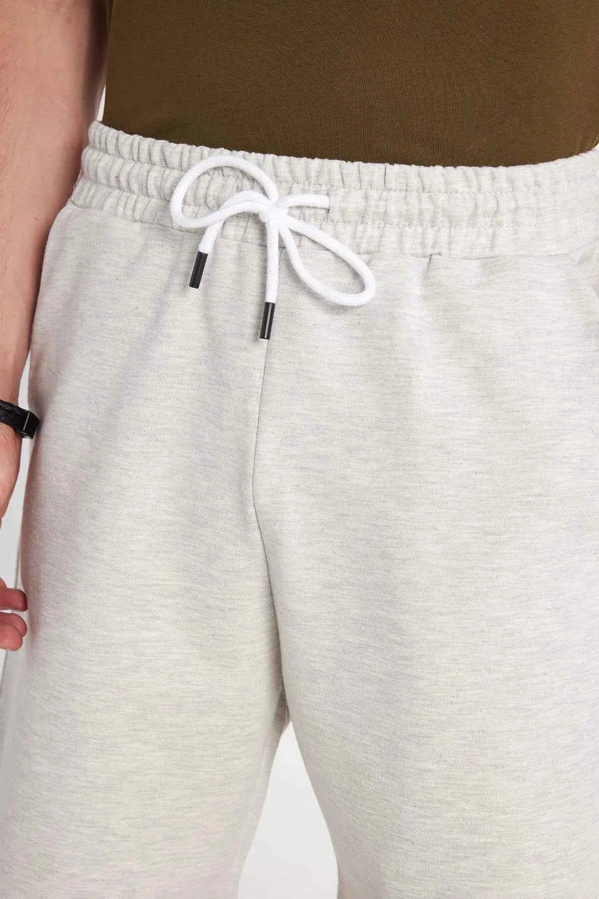 Men's light grey shorts with elastic waistband and white drawstring