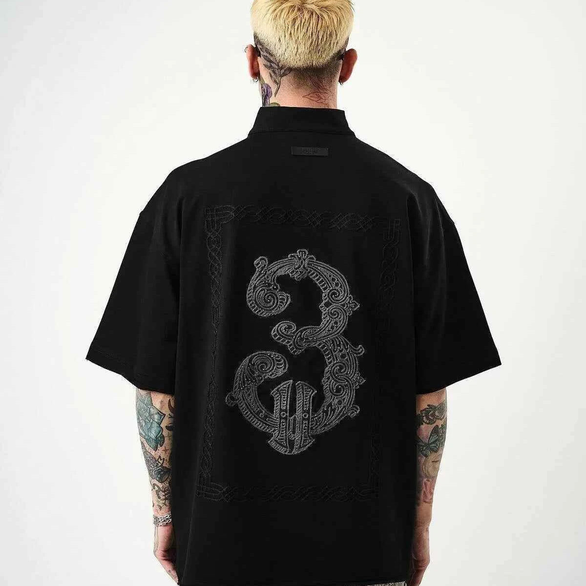 Black oversize men’s half-zip T-shirt with back embroidered guitar and dragon graphic