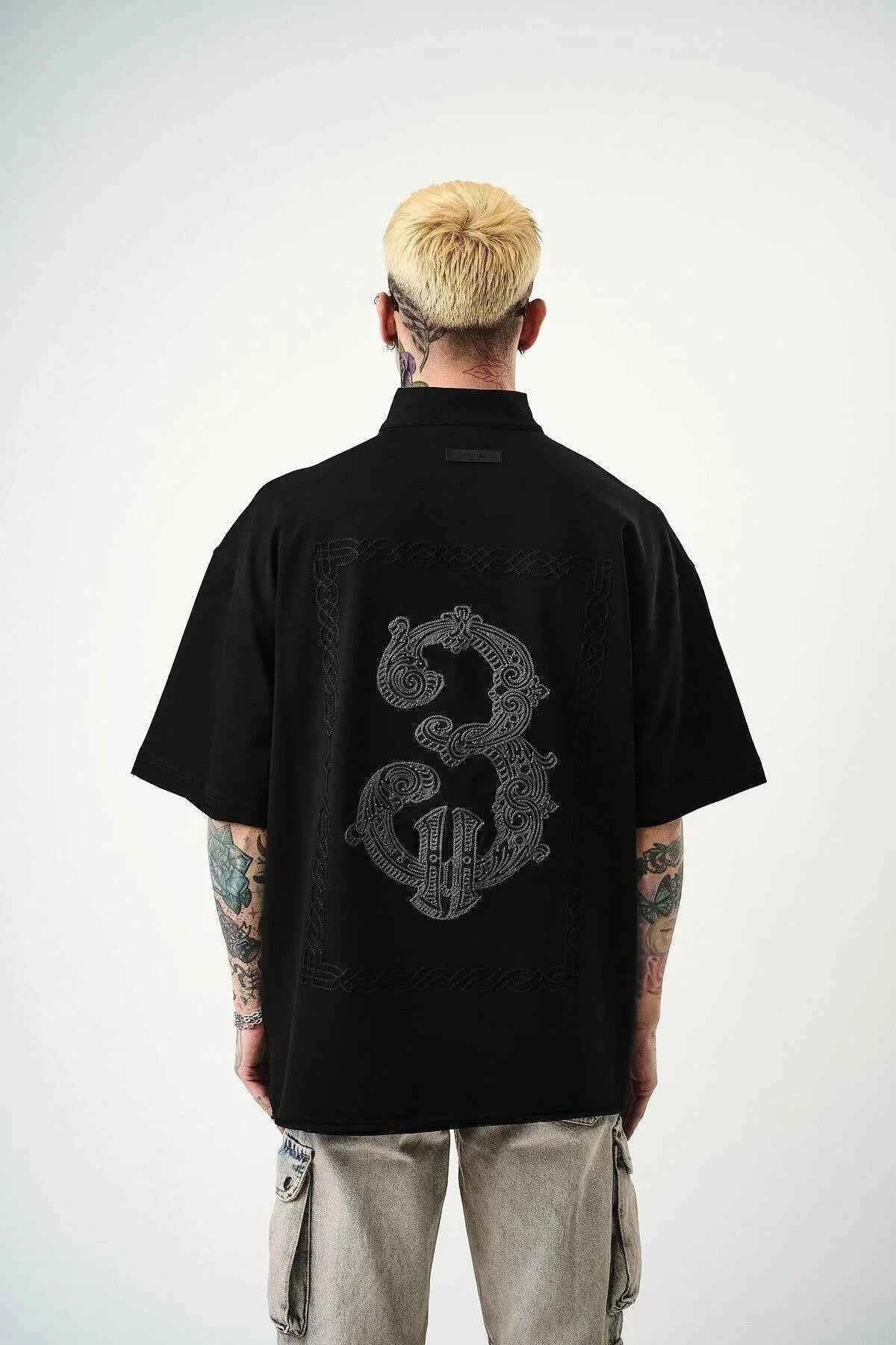 Black oversize men’s half-zip T-shirt with back embroidered guitar and dragon graphic