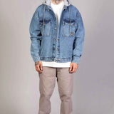 Oversized ice blue denim jacket with gray hood lining and button front