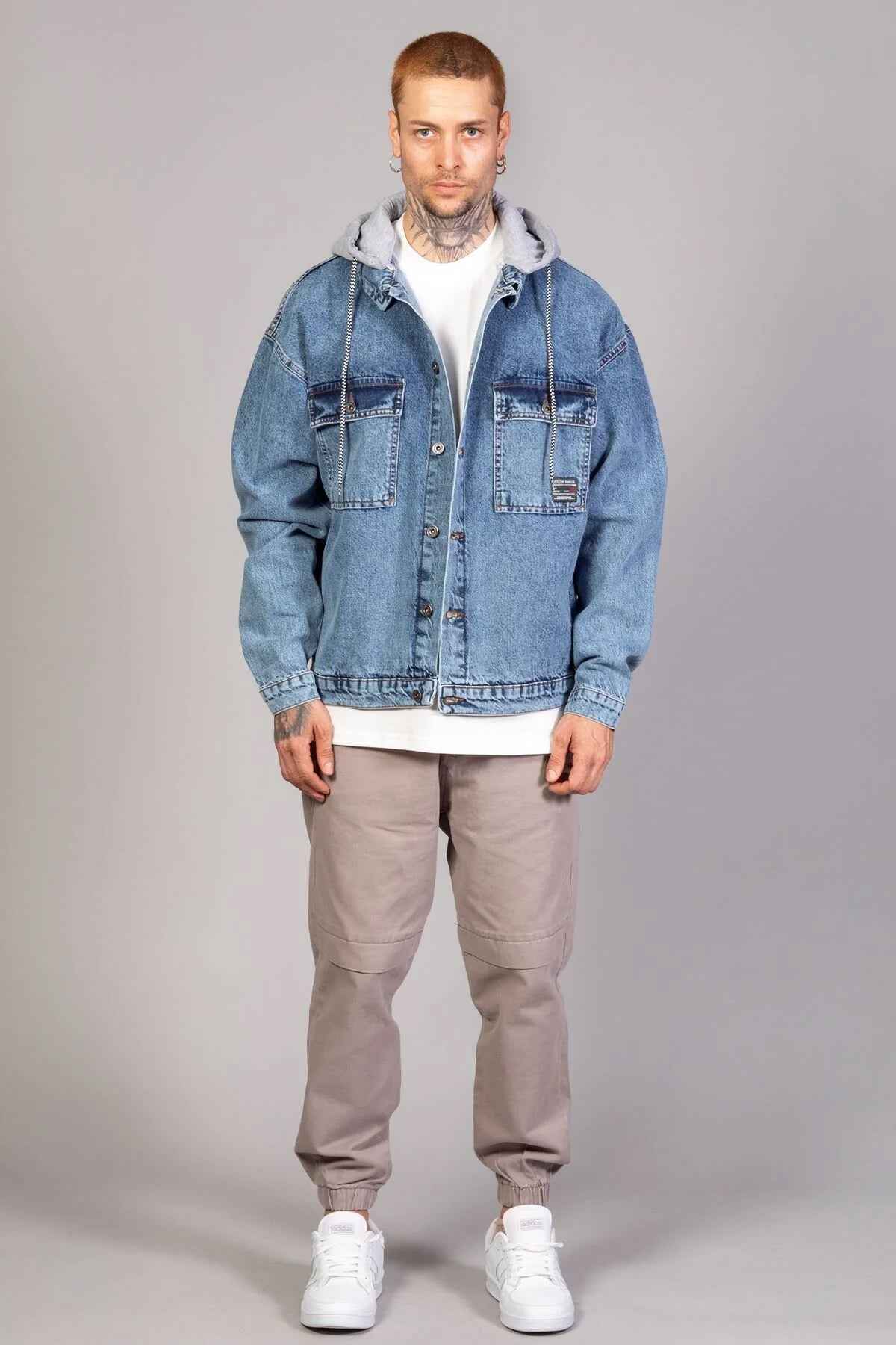 Oversized ice blue denim jacket with gray hood lining and button front