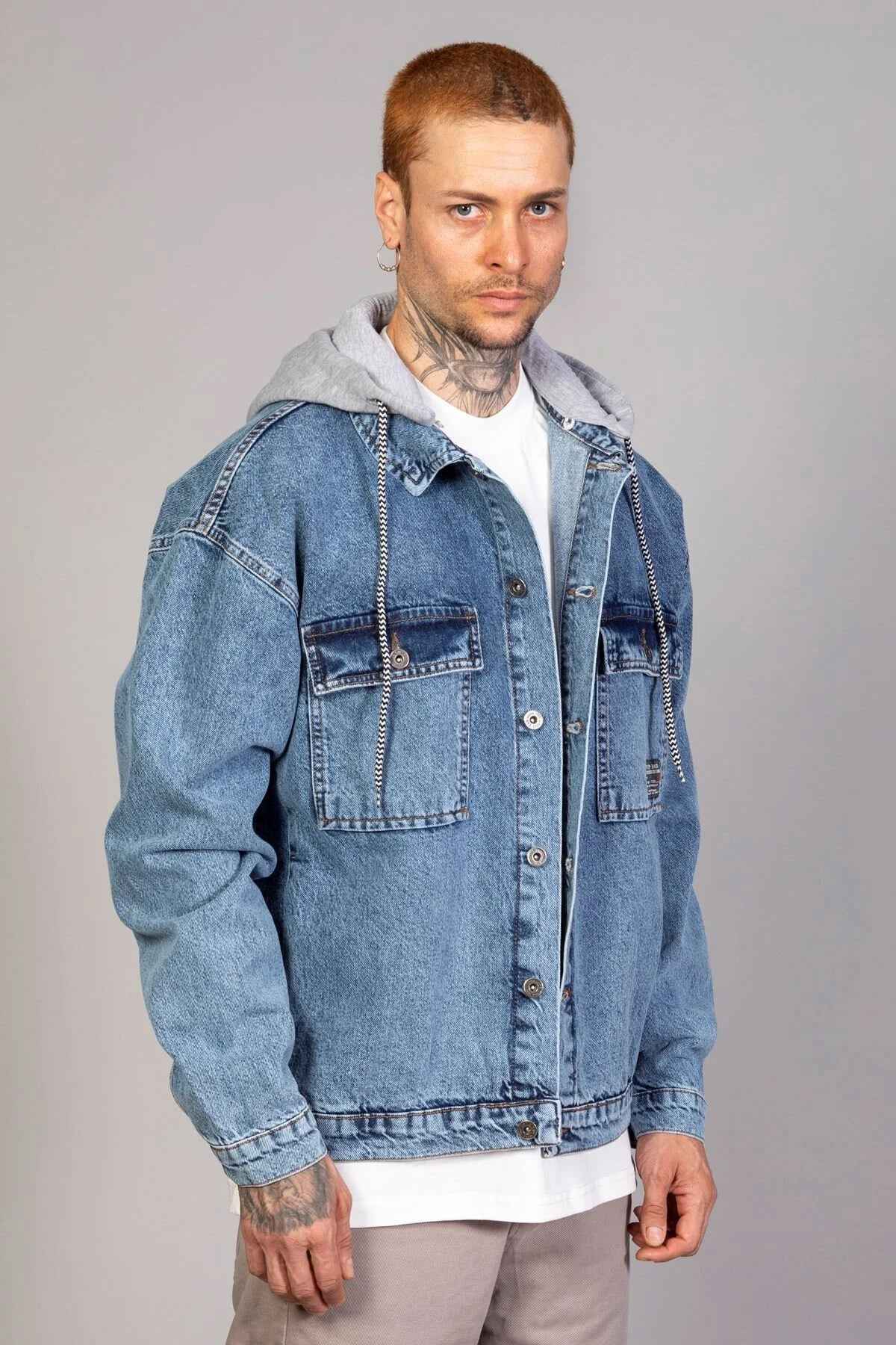 Oversized ice blue denim jacket with gray hood lining and chest pockets