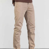 Men's beige jeans with zip fly, front pockets, and slim straight legs