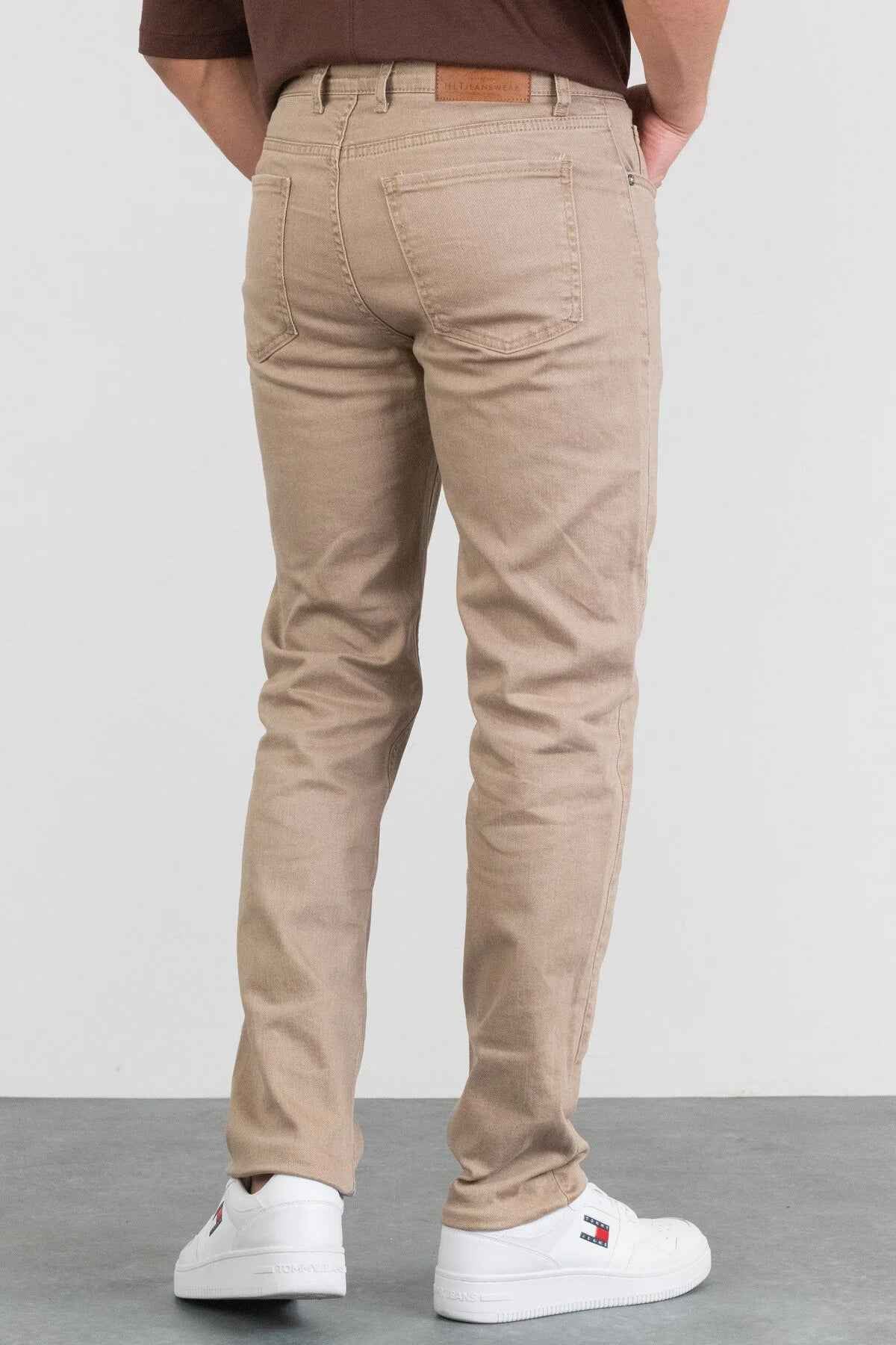 Men's beige jeans with back yoke stitching, button waist, and straight legs