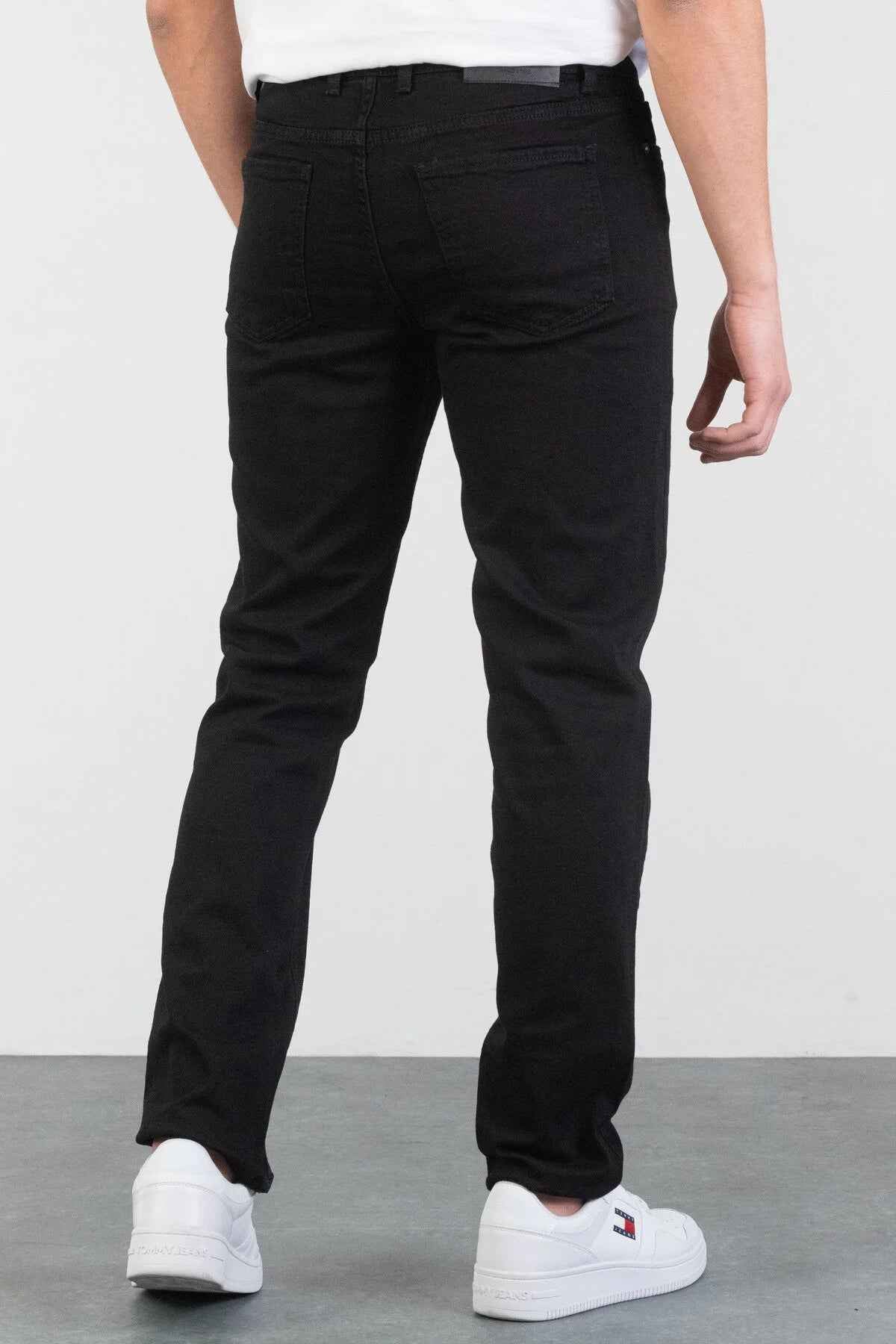 Men's black jeans, back view with belt loops and rear pockets, straight leg