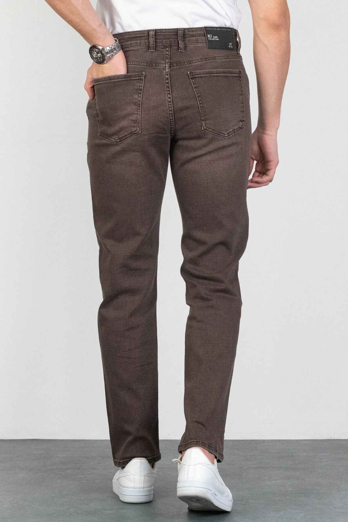 Men's dark brown jeans with back yoke, belt loops, and multiple patch pockets.