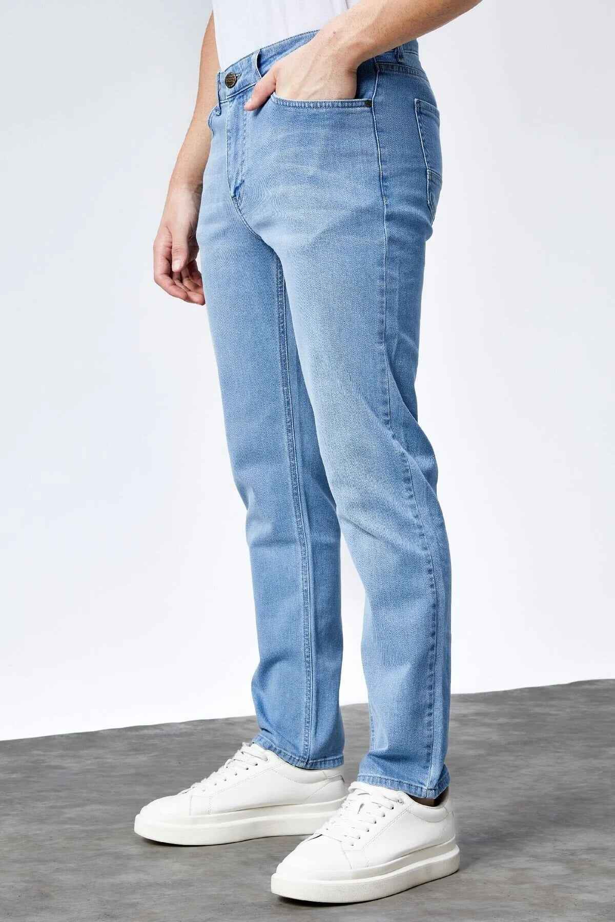 Light blue jeans, side view, with five-pocket styling and belt loops