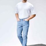 Light blue jeans with straight legs, front pockets, and button fly