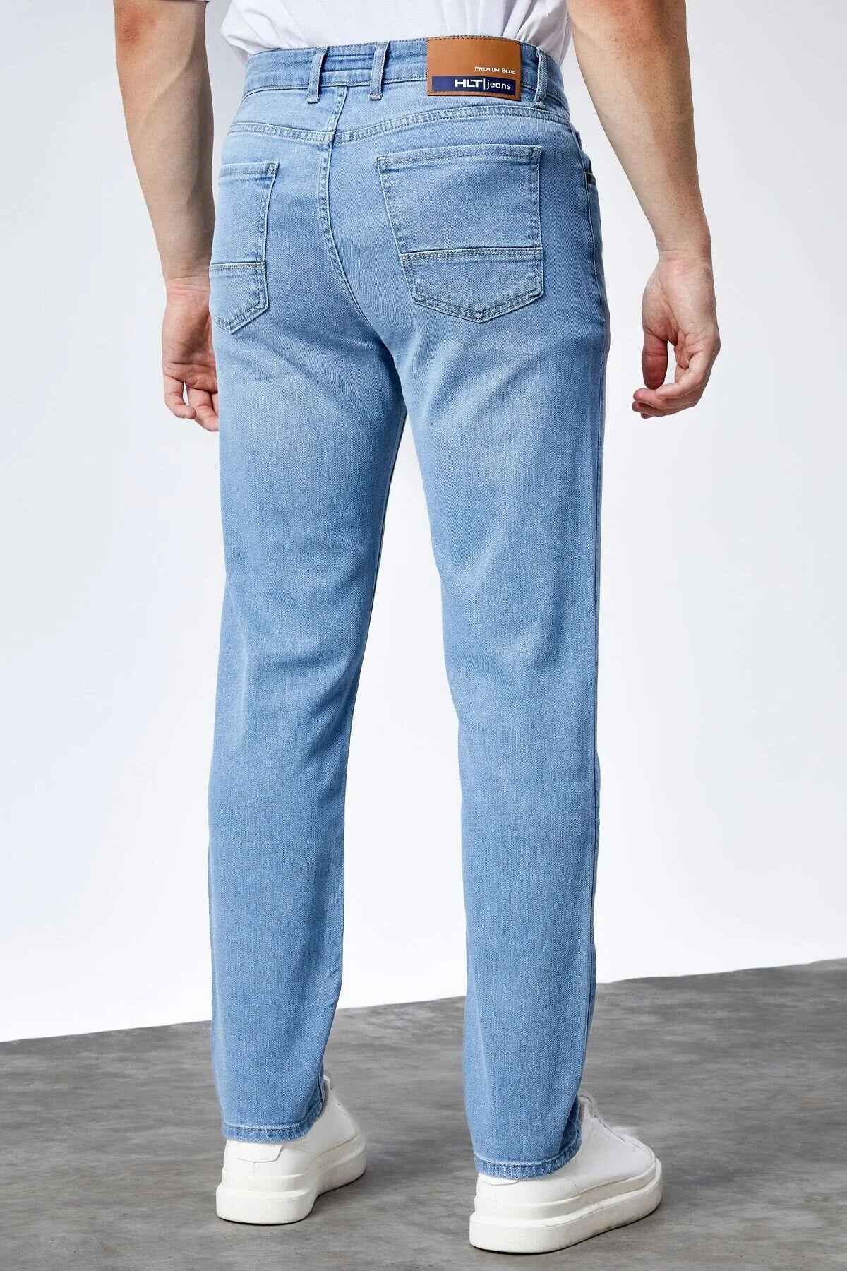 Light blue jeans back view with yoke, back pockets, and belt loops