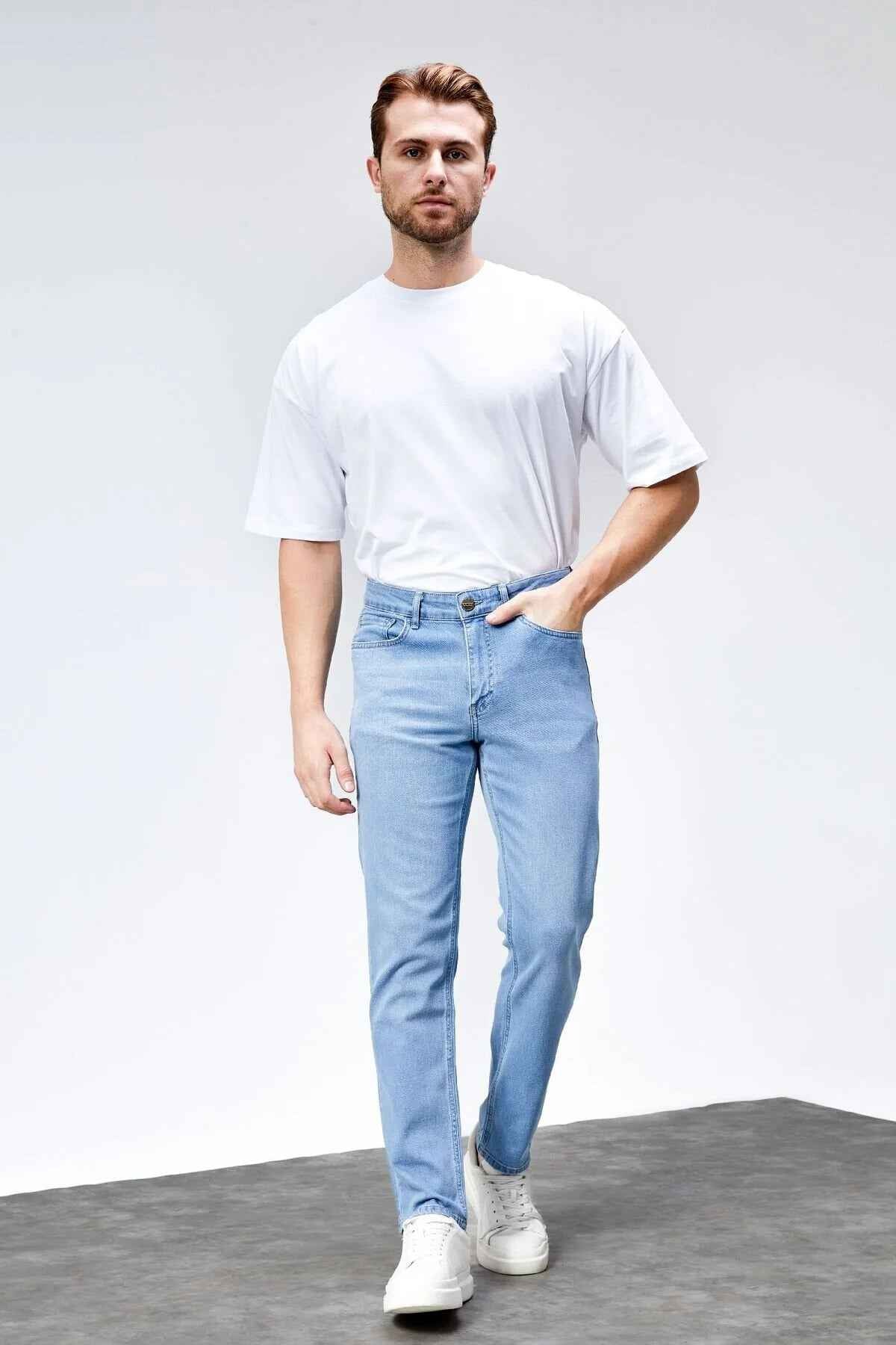 Light blue slim jeans with five-pocket design, button closure, and belt loops