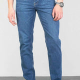 Light blue men's jeans with belt loops and faded wash
