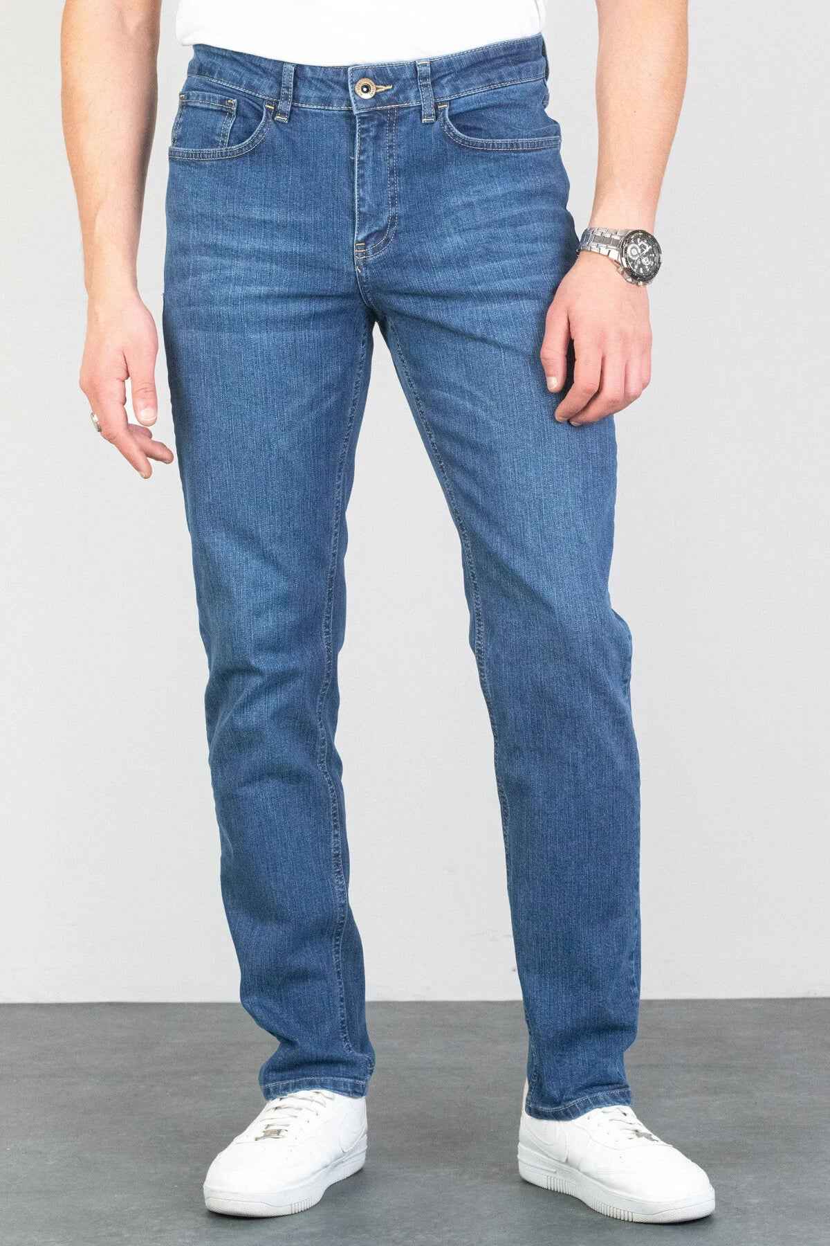 Light blue men's jeans with belt loops and faded wash