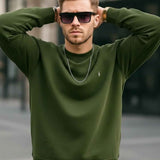 Men's crewneck sweatshirt with ribbed cuffs and hem; hands on head, small chest logo